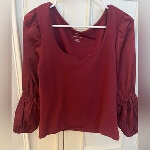 Anthropologie red top with satin sleeves size medium